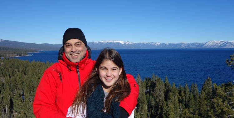 Father and Daughter pose in front of Lake Tahoe